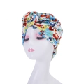Detail of red and blue floral print headscarf wrap on a white mannequin head - Style 3-Red Blue Yellow Floral