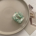 Detail of square hollow hair claw with mint green and cream shell patterns in acetate - Small Square Claw / Light Green