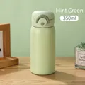 Mint green 350ml stainless steel vacuum insulated cup with matte finish and carry handle - Green