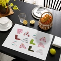 Christmas placemat with FA LA LA LA text pattern and festive candy cane motifs - CD57-22