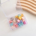 Top view of multi-colored flower mini hair claws inside a transparent plastic storage box - 2-Four-leaf Clover 20pcs Mixed Colors