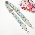 Detail of green geometric embroidered phone strap with golden metal lobster clasps - Light Green Diamond Strap