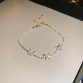 Close-up of golden butterfly bracelet with sparkling zircon stones and adjustable chain - Gold Butterfly