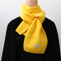 Solid yellow knitted scarf for women with small white woven label detail - Bright Yellow