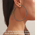 Detail of 8cm gunmetal hoop earrings with black rhinestones worn by a model - 8CM Gun Black Black Rhinestone