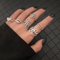 Retro silver ring set with snake, heart, and spider motifs on dark nail model - Spider Mushroom And Pin Combination Style (XT-14394)