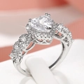 Elegant heart-cut zircon halo ring with pave-set crystals on a silver band - US 6 / White Gold