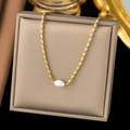Elegant gold bead necklace with a white baroque pearl on a champagne display cushion - Pearl Bead Chain Necklace / Gold