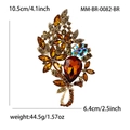 Vintage floral alloy brooch with amber crystals and champagne rhinestones on white background - Brown