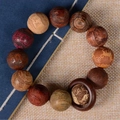 Bracelet en perles de bois sculptées multi-matériaux avec gravures d'animaux et de textes - 20mm Gravé / Perles Multi-Bois (Zodiaque)