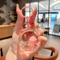Pink liquid quicksand keychain featuring a cute peach bear doll and heart sequins - Peach-Alarm Clock