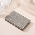 Detail of silver rhinestone business card holder case with sparkling crystal inlay - White
