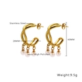 Detailed shot of gold twisted hoop earrings with triple pearl drops in stainless steel - Twisted Pearl Earrings / Gold