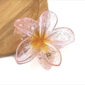 Macro shot of pink gradient flower hair claw clip with glitter details and spring - Glitter Gradient Pink