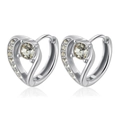 Macro detail of silver heart earrings with sparkling cubic zirconia on a white backdrop - Silver Heart
