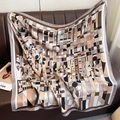 Close-up of geometric floral silk scarf draped on leather with premium satin finish - 90*90cm / Grey Border (XW-194)