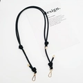 Close-up of black PU leather adjustable shoulder strap with knot and gold metal buckle - Gold Plate Hook / Black