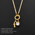 Elegant stainless steel necklace with 14K gold finish and cubic zirconia letter f charm. - Letter F (XNL0103)