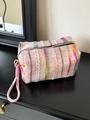 Pink knit plaid makeup bag with woven handle and colorful vertical stripe pattern - Handheld Pink Multi-Color Stripes