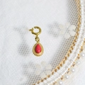 Vintage gold teardrop pendant with red natural stone and a secure round clasp - Red Teardrop Gem