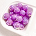 Macro shot of purple iridescent acrylic beads with UV pearl finish for DIY jewelry crafts - Dark Purple