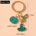 Detail of Halloween keychain with blue pumpkin, green wizard hat and colorful bat pendants - Green Pumpkin Witch Hat Bat
