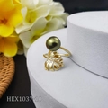Macro shot of gold monstera leaf ring with dark green pearl on a white pedestal - Dark Green Pearl Style (HEX1037-10)