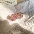 Detailed view of pink crystal pavé ball earrings on minimalist white paper background - 925 Sterling Silver Earring Post - Round - Colorful