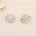 Macro detail of silver geometric stud earrings with sparkling rhinestones on stone - Steel Hammered Irregular Style (KE116418-KFC)