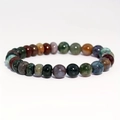 Macro detail of 8mm multicolored stone beads showing natural textures and polished finish - India Agate