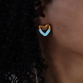 Gold and light blue heart-shaped enamel earrings in a modern fluid style on model - Blue/Gold