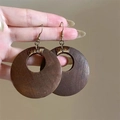 Detail of vintage round brown wooden earrings with golden wire wrapping and silver needles - Large Round Style (1#) / Brown