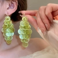 Close-up of light green shell-style layered round tassel earrings worn by a model - 36# Silver Pin-Green-Small