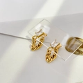 Macro detail of gold earrings with rectangular zircon and chunky Cuban link chain drops - Square Zircon Chain Earrings