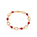 Elegant gold heart bracelet featuring red pear-cut stones and sparkling rhinestones - Red