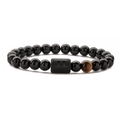 Detail of black beads bracelet with tiger eye stone and Gemini zodiac cylinder charm - Gemini
