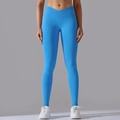 Close-up of the bright blue seamless yoga pants featuring a cross V-waistband and ribbed texture - S / Royal Blue