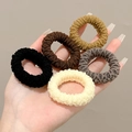 Hand holding high elasticity towel hair ties in black, brown, grey and beige colors - 03# 5 Pcs Set