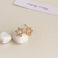 Macro shot of 18K gold plated star stud earrings with sparkling cubic zirconia inlay - 18K Gold Plated Golden Star Zirconia Studs