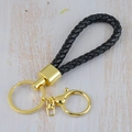 Handmade black braided leather keychain with golden metal ring and swivel hook for cars - Generation 1 Round Dragon Woven Buckle (Light Gold) / Black