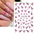 Close-up of pink butterfly nail stickers on long nails with watercolor floral accents - F1029 (Pink Purple Butterfly)