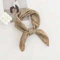 Silk-like brown houndstooth pattern square scarf tied in a bow with lifestyle props - 65*65cm / Houndstooth Camel