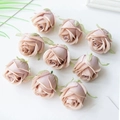 Nine light pink silk rose buds for DIY crafts and floral arrangements on white background - Coffee