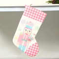 Pink nutcracker Christmas stocking with checkered patterns and snowflake candy details - Pink Plaid Nutcracker