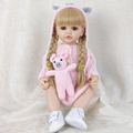 Reborn baby doll with blonde pigtails in pink knit onesie holding a small pig toy - Pink Pig Romper Blonde Hair / Doll Clothes (Outfit Only)