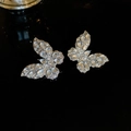 Sparkling silver butterfly ear cuff with zircon stones on a dark background - Stud Earrings / Silver Butterfly Stud Earrings (925 Silver Pin)