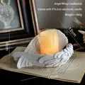 White resin angel wing candle holder with electronic candle and detailed feather textures - Angel Wings Holder + LED Candle