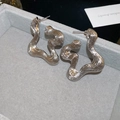 Macro shot of silver irregular ripple earrings with vertical texture on velvet display - Alien Wave Pattern Metal (48#)