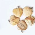 Five heart-shaped natural stone pendants in brown and beige tones with metal bails - Picture Jasper