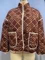 Brown quilted floral jacket with white piping and stand collar on mannequin - Coffee
